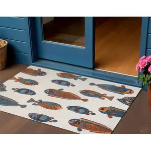Photo of Navy Blue Orange And Cream Animal Print Indoor Outdoor Area Rug