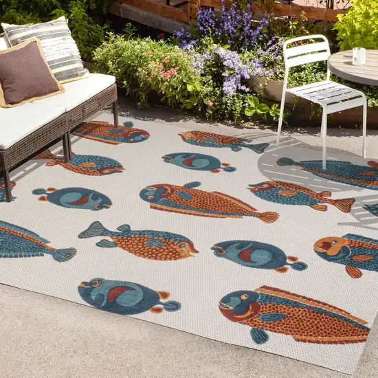 Navy Blue Orange And Cream Animal Print Indoor Outdoor Area Rug Photo 9