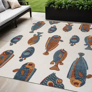Photo of Navy Blue Orange And Cream Animal Print Indoor Outdoor Area Rug