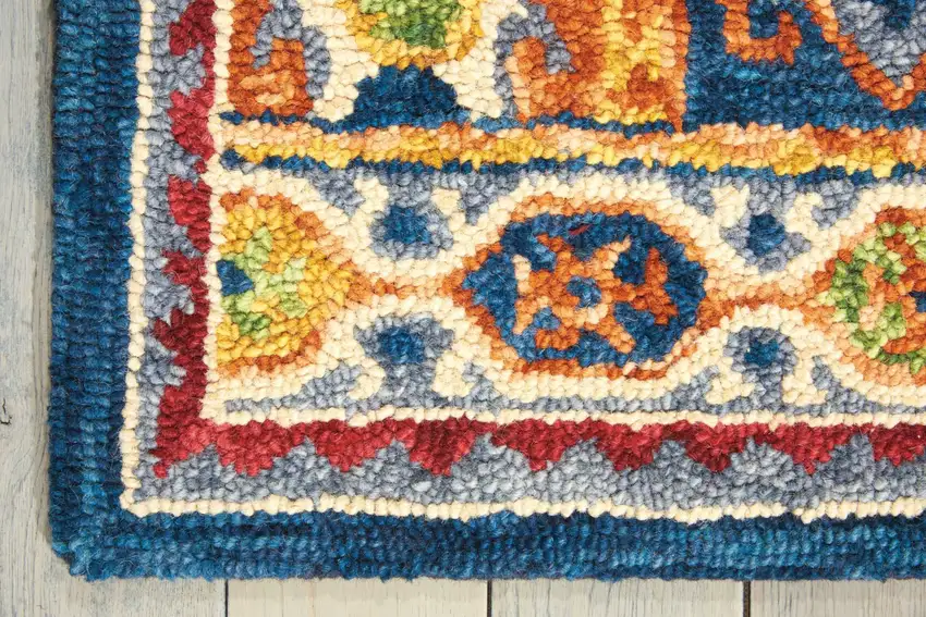 Navy Blue Orange And Green Wool Floral Hand Tufted Distressed Area Rug Photo 4