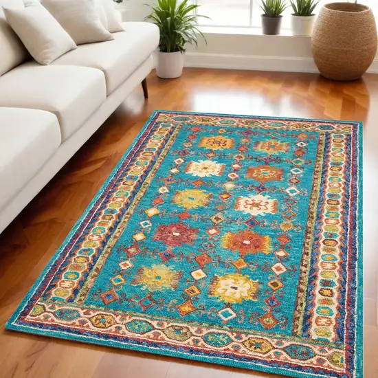 Navy Blue Orange And Green Wool Floral Hand Tufted Distressed Area Rug Photo 1