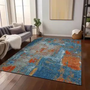 Photo of Navy Blue Orange And Ivory Abstract Washable Indoor Outdoor Area Rug