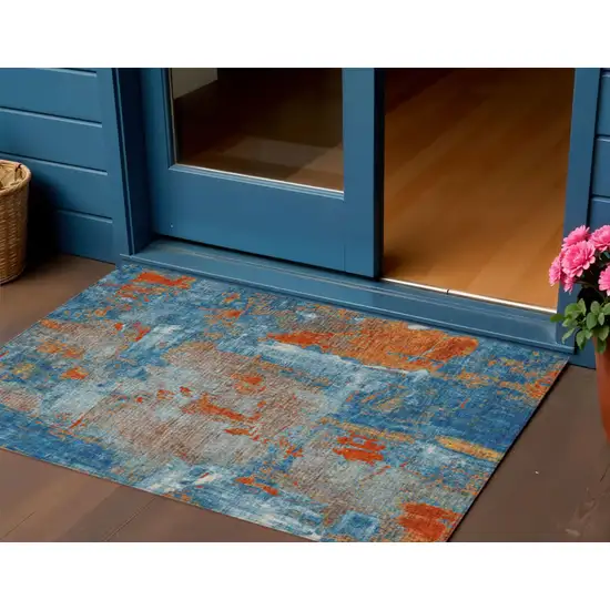 Navy Blue Orange And Ivory Abstract Washable Indoor Outdoor Area Rug Photo 1