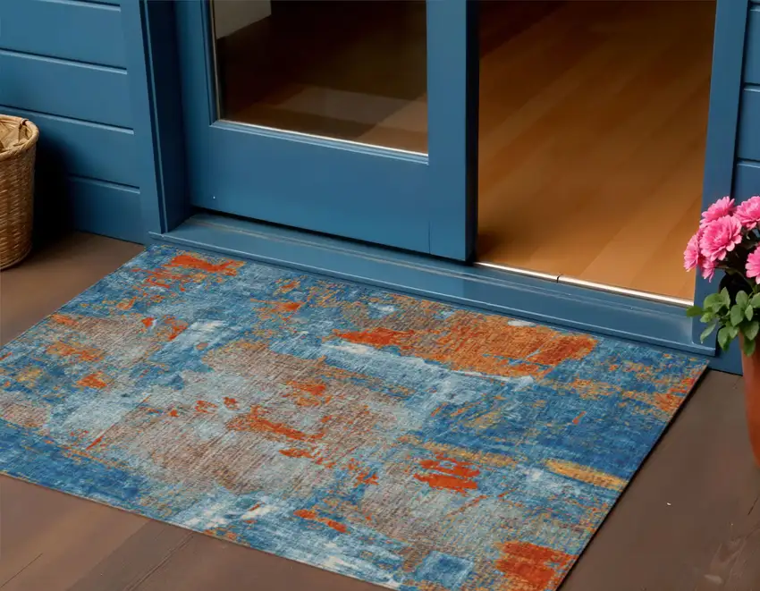 Navy Blue Orange And Ivory Abstract Washable Indoor Outdoor Area Rug Photo 1