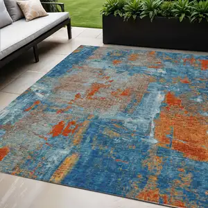 Photo of Navy Blue Orange And Ivory Abstract Washable Indoor Outdoor Area Rug