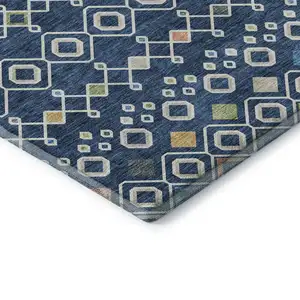 Photo of Navy Blue Peach And Gold Southwestern Washable Area Rug With UV Protection