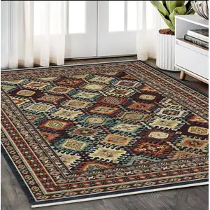 Photo of Navy Blue Red And Orange Oriental Area Rug With Fringe