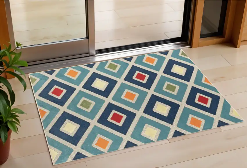 Blue And Ivory Geometric Stain Resistant Indoor Outdoor Area Rug Photo 1