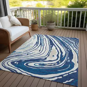 Photo of Navy Blue Teal Blue And Ivory Abstract Washable Indoor Outdoor Area Rug