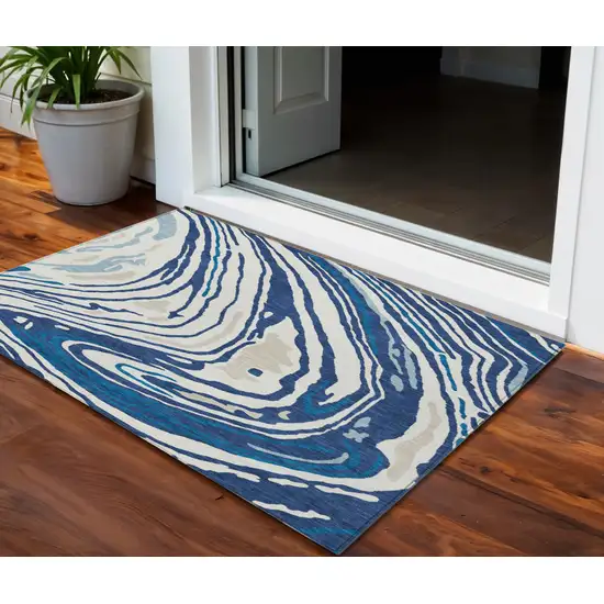 Navy Blue Teal Blue And Ivory Abstract Washable Indoor Outdoor Area Rug Photo 1