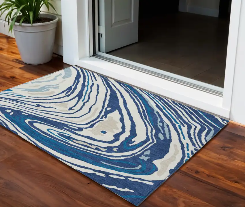 Navy Blue Teal Blue And Ivory Abstract Washable Indoor Outdoor Area Rug Photo 1