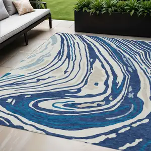 Photo of Navy Blue Teal Blue And Ivory Abstract Washable Indoor Outdoor Area Rug