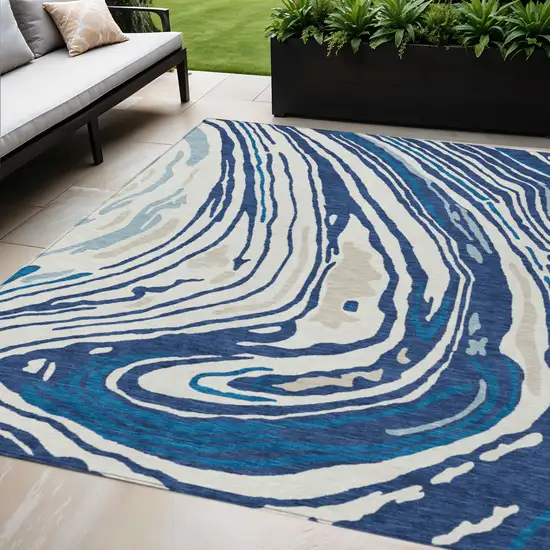 Navy Blue Teal Blue And Ivory Abstract Washable Indoor Outdoor Area Rug Photo 1