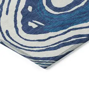 Photo of Navy Blue Teal Blue And Ivory Abstract Washable Indoor Outdoor Area Rug