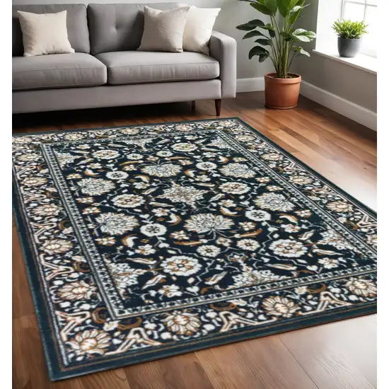 Navy Caramel And Ivory Oriental Power Loom Stain Resistant Area Rug Photo 1