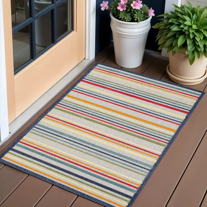 Ivory And Blue Striped Stain Resistant Indoor Outdoor Area Rug Photo 1