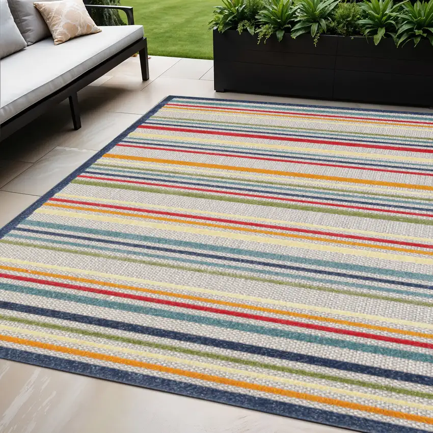 Ivory And Blue Striped Stain Resistant Indoor Outdoor Area Rug Photo 1