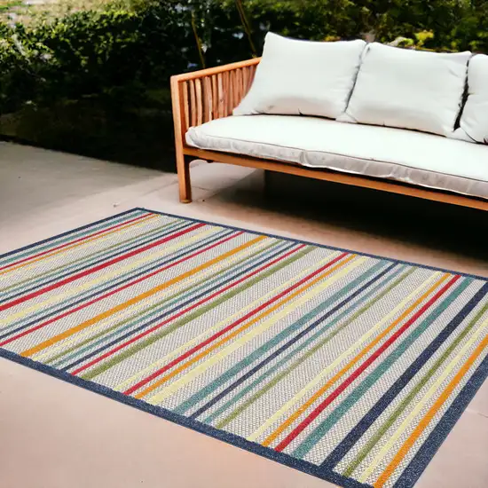 Ivory And Blue Striped Stain Resistant Indoor Outdoor Area Rug Photo 1
