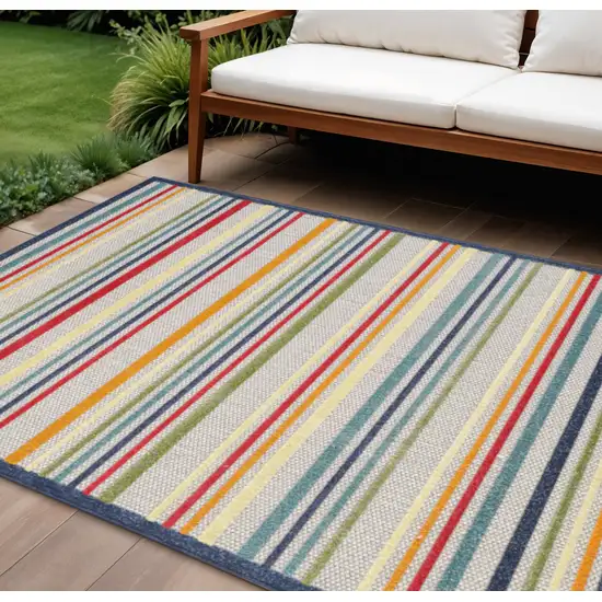 Ivory And Blue Striped Stain Resistant Indoor Outdoor Area Rug Photo 1