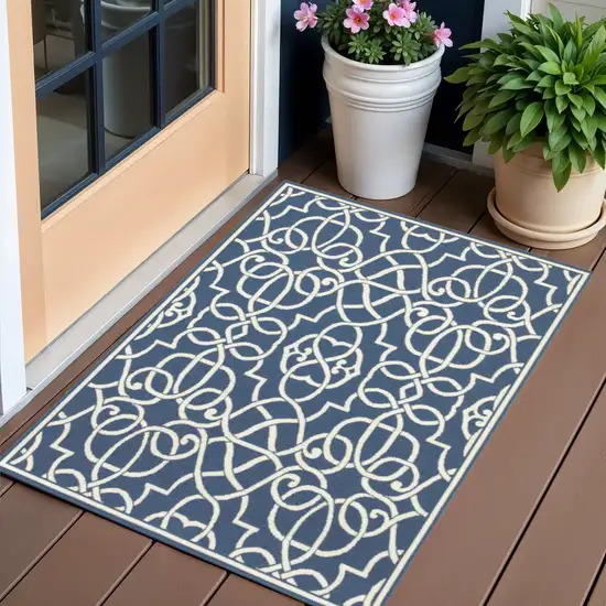 Blue and Ivory Geometric Stain Resistant Indoor Outdoor Area Rug Photo 1