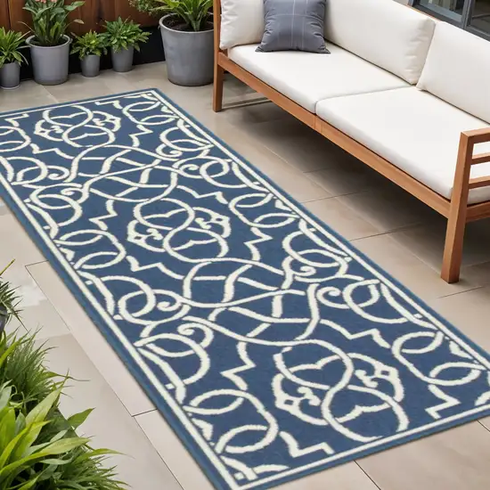 Blue and Ivory Geometric Stain Resistant Indoor Outdoor Area Rug Photo 1