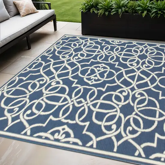 Blue and Ivory Geometric Stain Resistant Indoor Outdoor Area Rug Photo 1