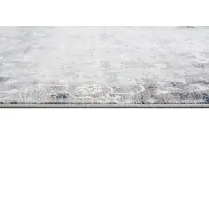 Photo of Navy and Beige Distressed Vines Area Rug