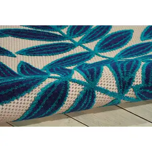 Photo of Navy and Beige Leaves Indoor Outdoor Area Rug