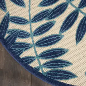 Photo of Navy and Beige Leaves Indoor Outdoor Area Rug