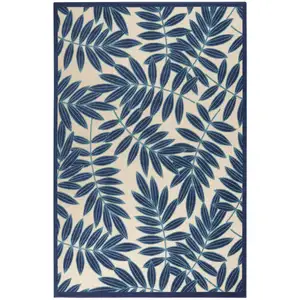 Photo of Navy and Beige Leaves Indoor Outdoor Area Rug