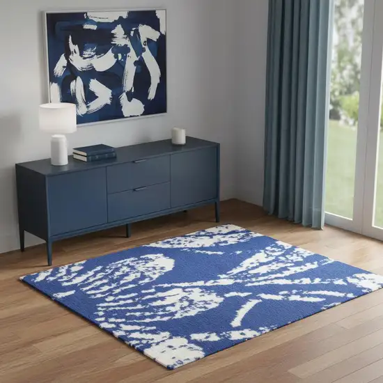 Navy Blue And Ivory Floral Distressed Area Rug Photo 1