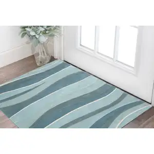 Photo of Ocean Blue Teal Hand Tufted Abstract Waves Indoor Accent Rug