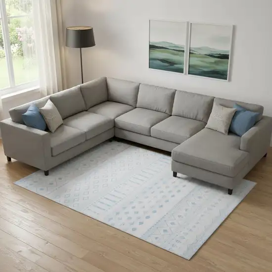 Off White And Light Blue Geometric Distressed Area Rug Photo 1