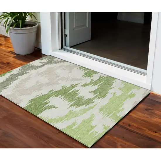Olive Green And Beige Abstract Washable Indoor Outdoor Area Rug Photo 1