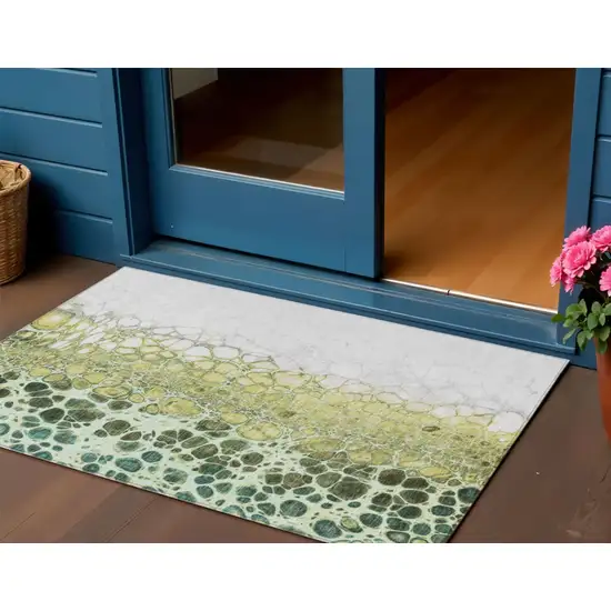 Olive Green And Gold Abstract Washable Indoor Outdoor Area Rug Photo 1