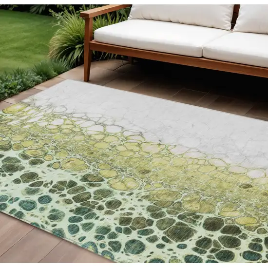 Olive Green And Gold Abstract Washable Indoor Outdoor Area Rug Photo 1