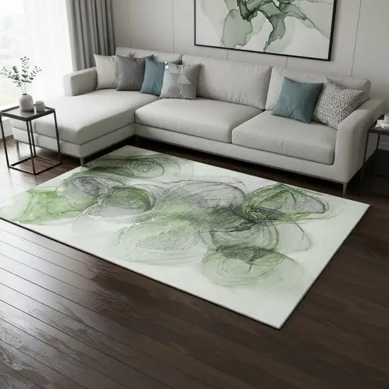 Olive Green And Ivory Abstract Washable Area Rug With UV Protection Photo 1