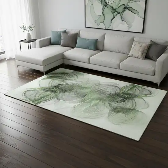 Olive Green And Ivory Abstract Washable Area Rug With UV Protection Photo 1