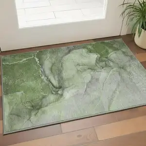 Photo of Olive Green And Ivory Abstract Washable Area Rug With UV Protection