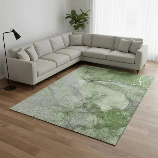 Olive Green And Ivory Abstract Washable Area Rug With UV Protection Photo 1