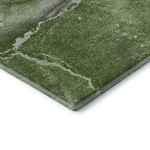 Photo of Olive Green And Ivory Abstract Washable Area Rug With UV Protection