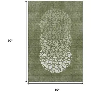 Photo of Olive Green And Ivory Abstract Washable Area Rug With UV Protection