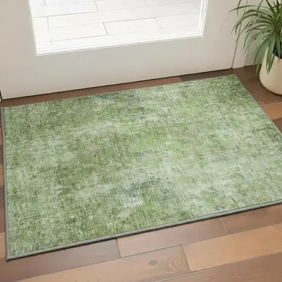 Olive Green And Ivory Abstract Washable Area Rug With UV Protection Photo 3