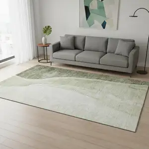 Photo of Olive Green And Ivory Abstract Washable Area Rug With UV Protection