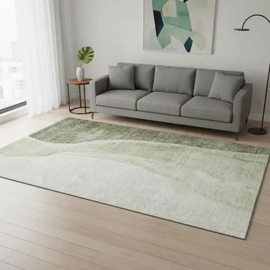 Olive Green And Ivory Abstract Washable Area Rug With UV Protection Photo 1
