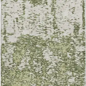 Photo of Olive Green And Ivory Abstract Washable Area Rug With UV Protection