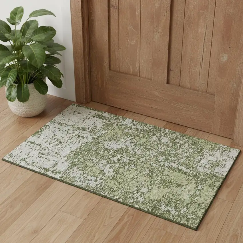 Olive Green And Ivory Abstract Washable Area Rug With UV Protection Photo 1