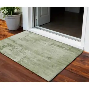 Photo of Olive Green And Ivory Abstract Washable Indoor Outdoor Area Rug