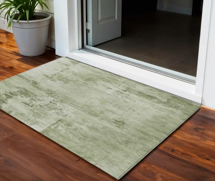Olive Green And Ivory Abstract Washable Indoor Outdoor Area Rug Photo 1