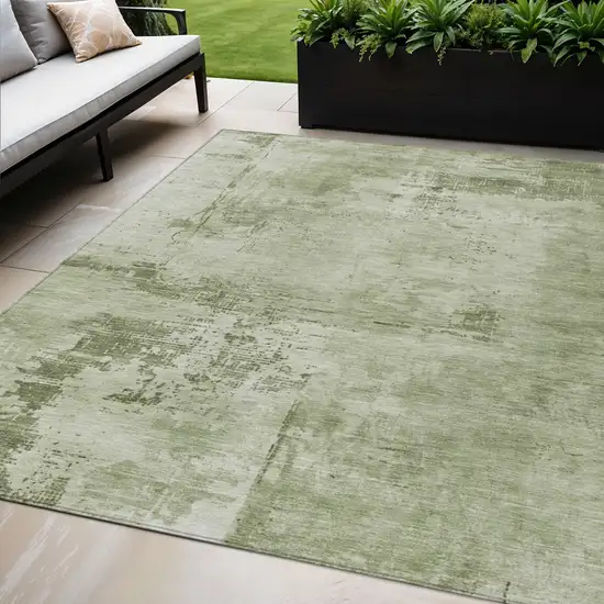 Olive Green And Ivory Abstract Washable Indoor Outdoor Area Rug Photo 1